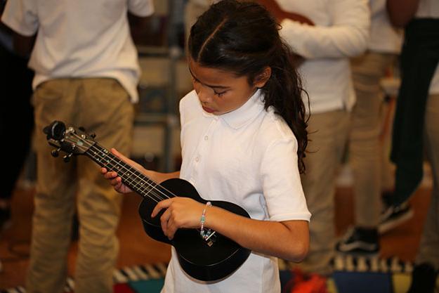Girl learning ukulele